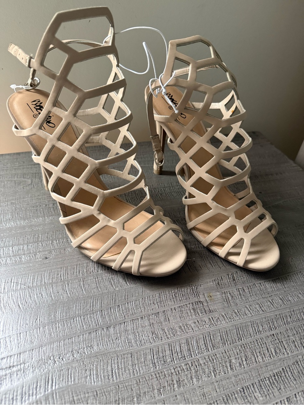Cage-style strappy heels.